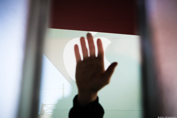 Apple security tries to block the cameras from peering through the front windows of the Novell Theater